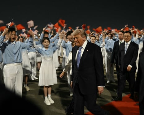 Donald Trump is escorted to his motorcade upon his arrival in Beijing, 13 May 2026.