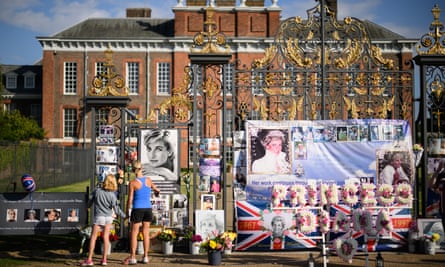 People view tributes to the late Diana left outside Kensington Palace in August last year to mark the 25th anniversary of her death.