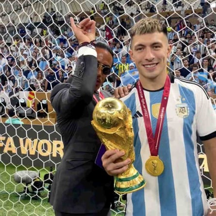 Gökçe did his signature salt-sprinkling gesture over the trophy, held here by Argentina’s Lisandro Martinez.