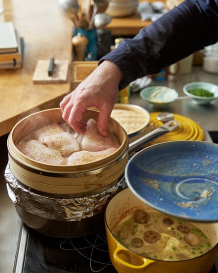 Outlaw places fish fillets in his steamer.