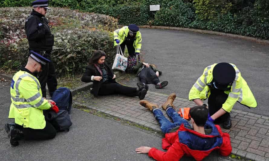 Protesters from Insulate Britain are arrested by police in a car park near the Dartford Crossing