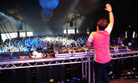 The crowd jumps for a DJ at Creamfields in 2012.