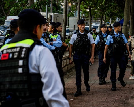 Police keep watch outside the court