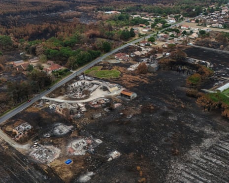 This aerial photograph shows burnt properties in an area hit by the wildfire that swept through the Gironde region in Le Porge, south-western France.