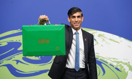 Rishi Sunak, the then chancellor, holding his ‘green box’ at the Cop26 summit in Glasgow last year.