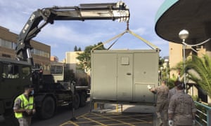 Soldiers install modules in the car park of the Hospital Clinico Universitario in Zaragoza, Spain, Tuesday Aug. 11, 2020. Spain’s army is setting up a field hospital in Zaragoza as the northern city struggles to stop a new spike in cases of the coronavirus.