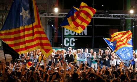 Together For Yes supporters wave flags after polls closed in a regional parliamentary election in Barcelona<br>