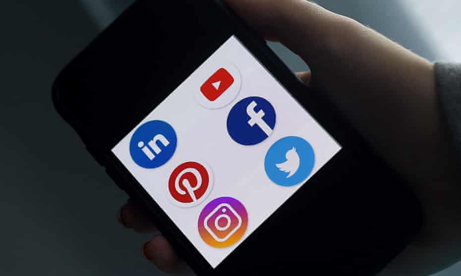A smartphone with social media app logos