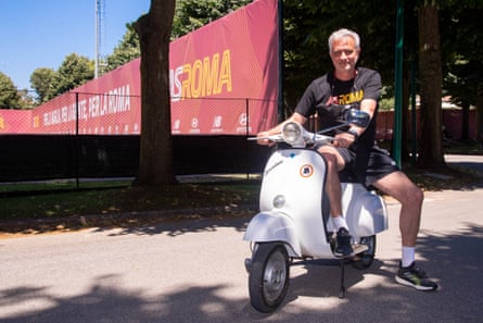 Mourinho rides a vespa after his arrival at the club.