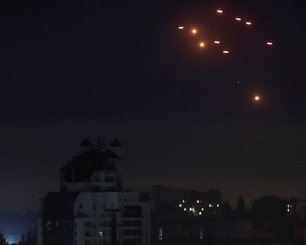 explosions at night above a city