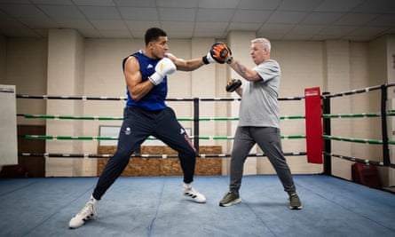 Delicious Orie practices with a trainer at a gym in Birmingham