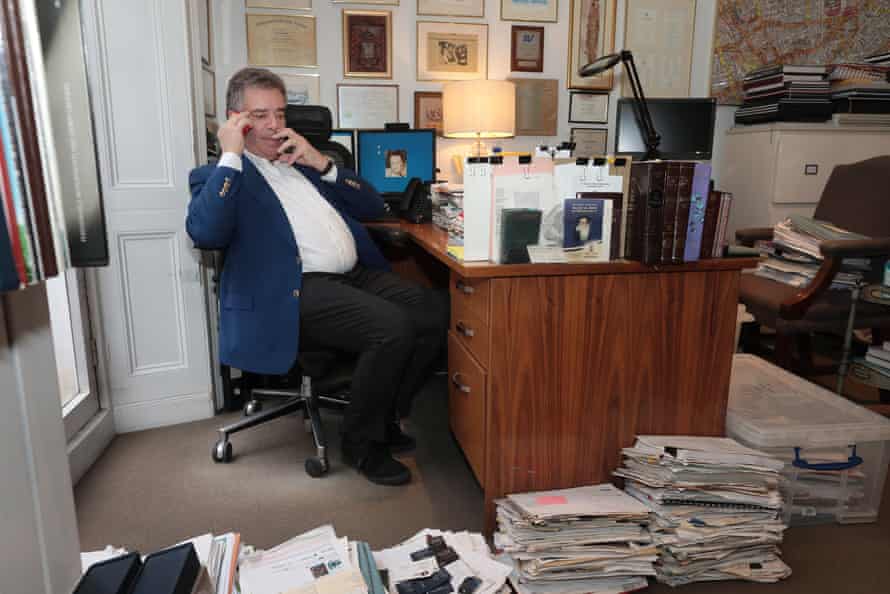 Hersham at his desk in the Beauchamp Estates office.