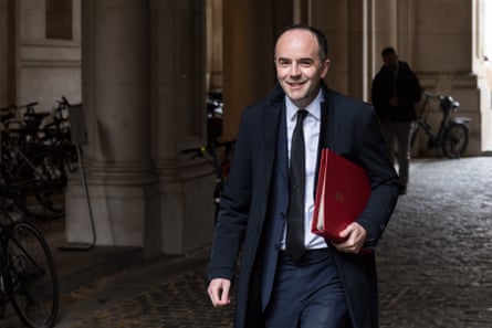 James Murray arrives in Downing Street. He carries a red folder under one arm.