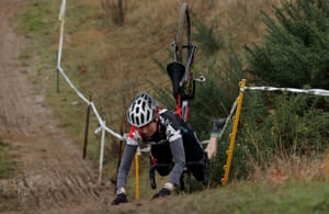 Elizabeth Clayton of GB falls into a gorse bush while competing in the women’s 60-64 category race.