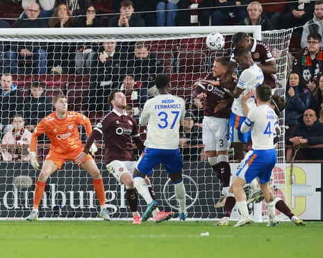 Olwethu Makhanya jumps between two Hearts defenders for Rangersâ second