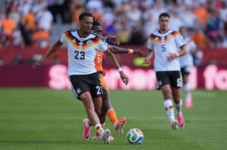 Singo of Ivory Coast in action against Nmecha of Germany