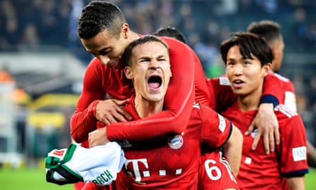 Bayern’s Joshua Kimmich and teammate Thiago celebrate victory over Borussia Mönchengladbach.