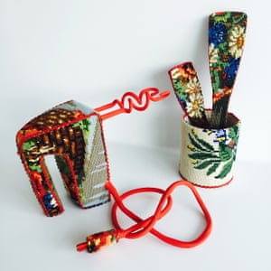 A hand-held mixer and spatulas by Swedish designer Ulla-Stina Wikander, who covers 1970s household objects in second-hand cross-stitches
