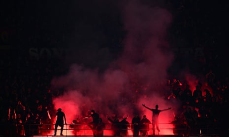 Milan fans light flare bombs during the UEFA Champions League semi-final first leg football match between AC Milan and Inter Milan.