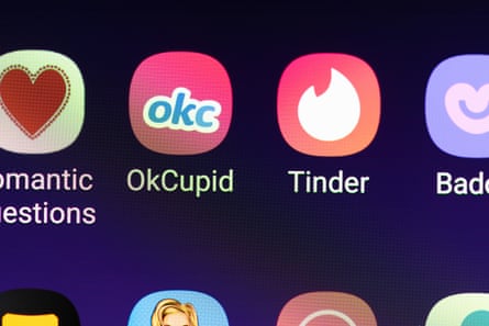 Dating apps OkCupid and Tinder on a smartphone screen