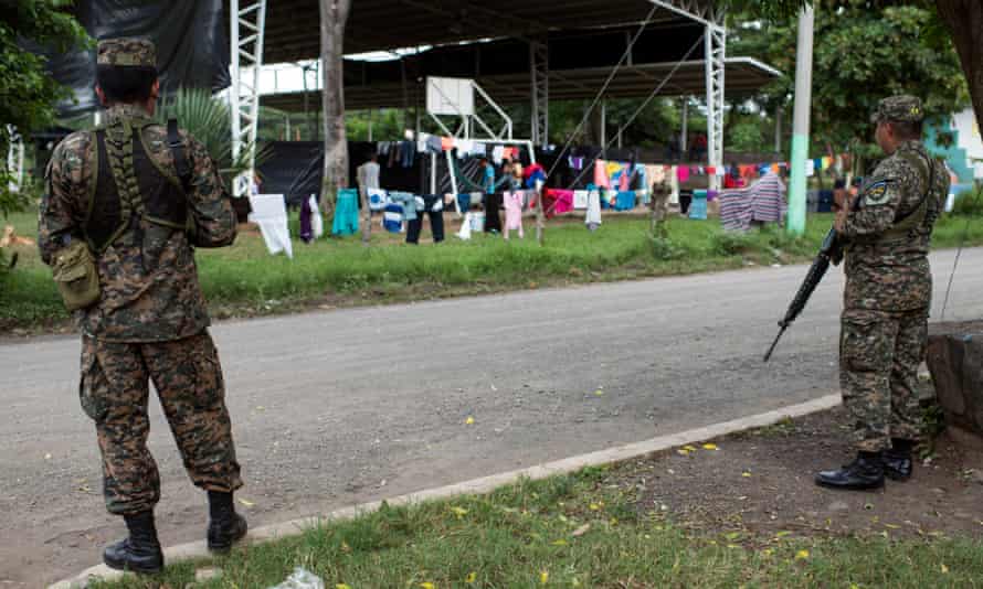 Militars are in charge of the 24 hour security of the shelter for displaced people in Caluco, Sonsonate.