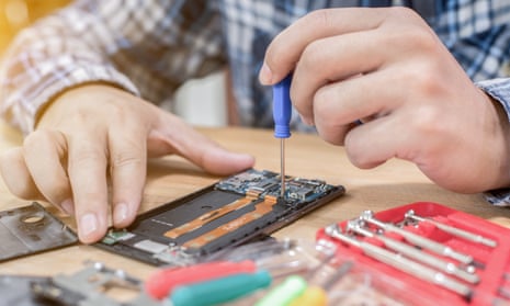 Stock photo of a mobile phone being repaired