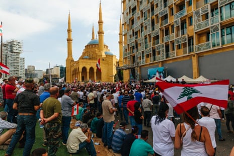 People waiving flags during a demonstration in Martyrs’ Square on 17 July, 2020. People gather to demonstrate in support of pensioners of the Lebanese Armed Forces who saw their pensions cut from 800$ - 1000$ to 150$ - 200$.