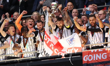 Kyle Cameron lifts the National League Play-Off Final Trophy.