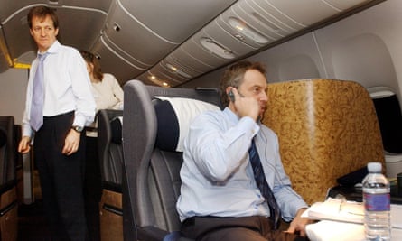 Blair speaks on the phone watched Alastair Campbell on 16 March 2003 while flying back from a summit with Bush