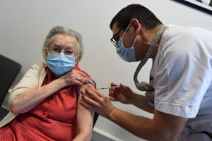 A resident of a retirement home receives a dose of the Pfizer/BioNtech Covid-19 vaccine in Loos, northern France