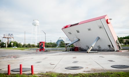 The overhang of a gas station is toppled over in the aftermath of Hurricane Michael in Inlet Beach, Florida.