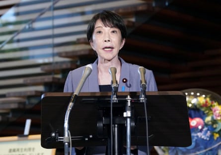 Sanae Takaichi stood behind a lectern