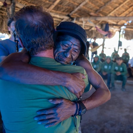 Pedro dos Santos Uiriri hugs Lucas Albertoni, an Indigenous health specialist who worked with Pereira in the Javari
