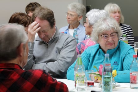 Jenny Davies sitting at a table with other people