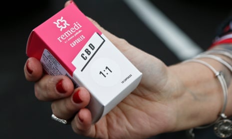 A woman holds the prescribed medical marijuana product used to treat her daughter’s epilepsy after making a purchase at a medical marijuana dispensary in Butler, Pennsylvania. Two new studies released on Monday, April 2, 2018 suggest that legalization of marijuana may reduce the prescribing of opioids.