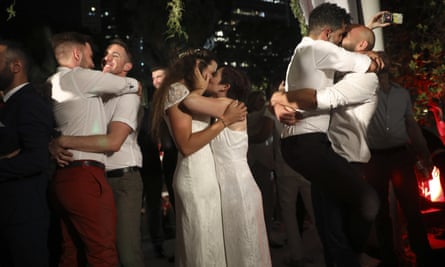 The gay couples participated in a mass wedding in Tel Aviv to demand the right to same-sex marriage.