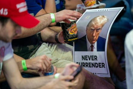 Supporters of former Trump wait to hear him speak.