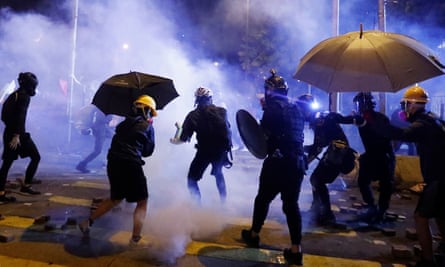 Anti-government protesters clash with the police outside the Polytechnic University in Hong Kong.