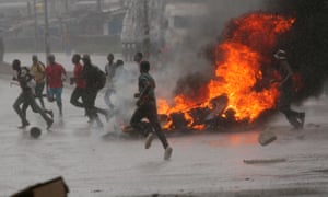 Protesters set up barricades in Harare on 14 January after the price of fuel was doubled.