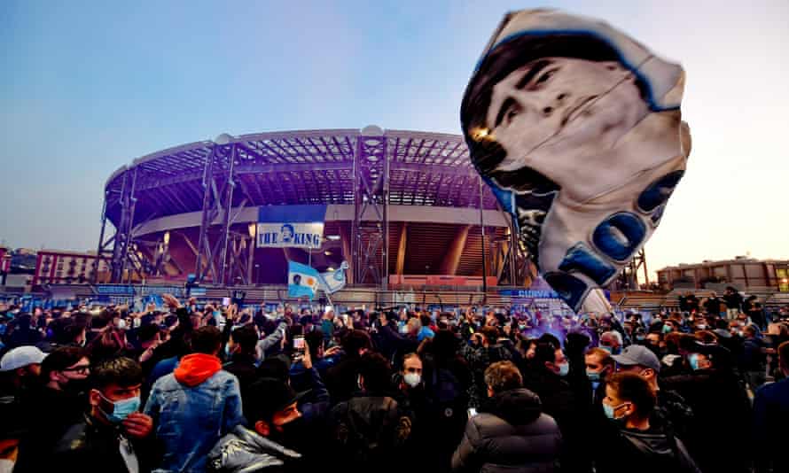 Napoli fans gather outside the San Paolo Stadium to pay tribute to Diego Maradona.