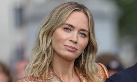 Emily Blunt poses for the camera at a photocall for the film Oppenheimer