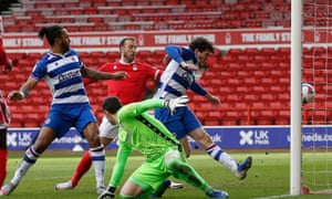 The ball is heading into the Reading net via either Reading’s Tom Holmes or Forest’s Glenn Murray.