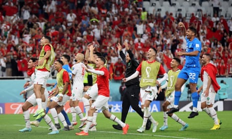 Morocco players celebrate after the match.