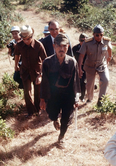 Former Japanese imperial army soldier Hiroo Onoda walking from the jungle where he had hidden since the second world war, on Lubang island in the Philippines, 11 March 1974.