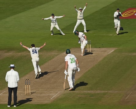 The Warwickshire bowler Ethan Bamber celebrates bowling Leicestershire’s Tom Scrivens to confirm his team as winners of the County Championship.