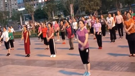 People dance in a public square in China – video