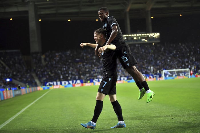 Brugge's Andreas Skov Olsen, left, celebrates after scoring his side's third goal.
