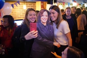 London, EnglandWomen pose with a cardboard cutout of Kamala Harris at the Democrats Abroad US election event in London.