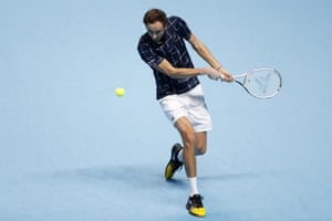 Daniil Medvedev returns the ball to Rafael Nadal.