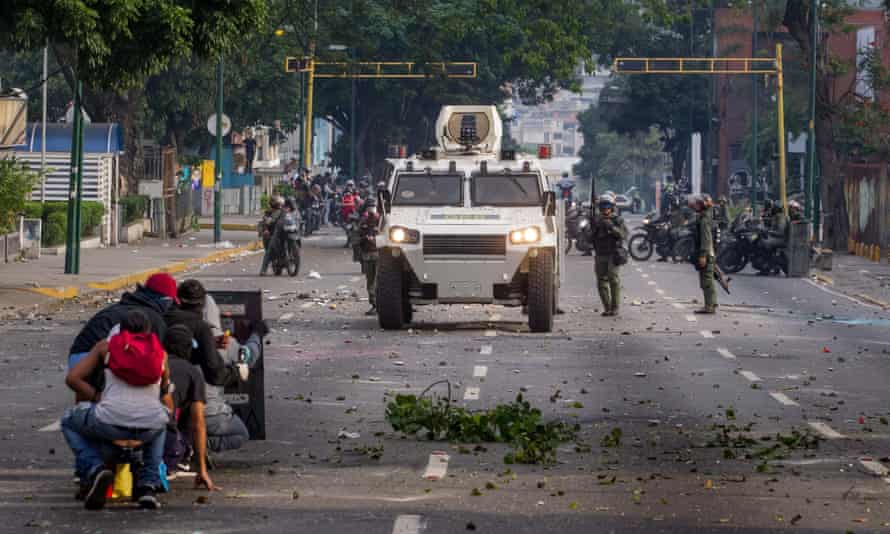 Demonstrators clash with police during protests in Caracas.